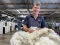 Dan Owens, Nanena, The Lagoon, checks over some of his 16-micron wool during shearing this week. Picture by Karen Bailey.